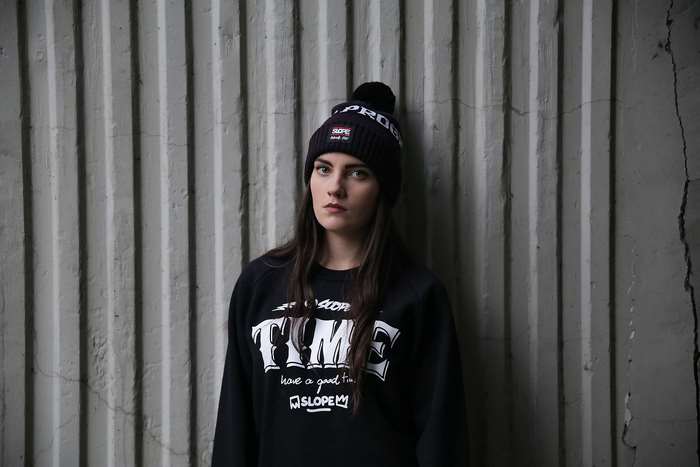 Woman wearing a beanie and sweater