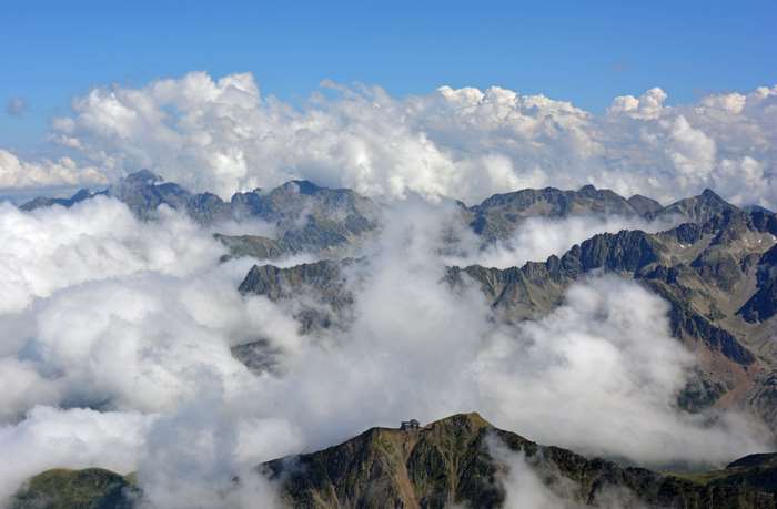 Mountain ranges in the Pyrenees with clouds