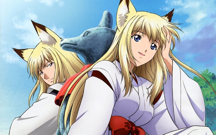 Two fox-eared girls in kimonos with a stone fox statue