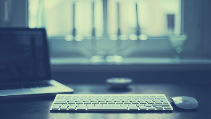 Apple Laptop, Keyboard, and Mouse on a Desk