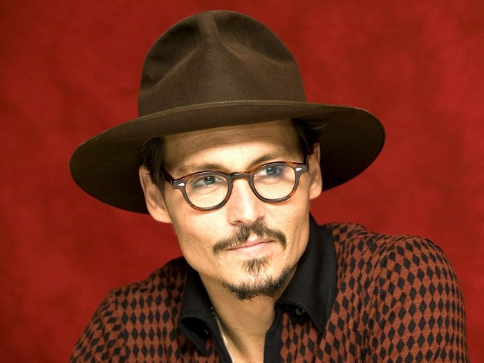 Johnny Depp wearing a hat and glasses