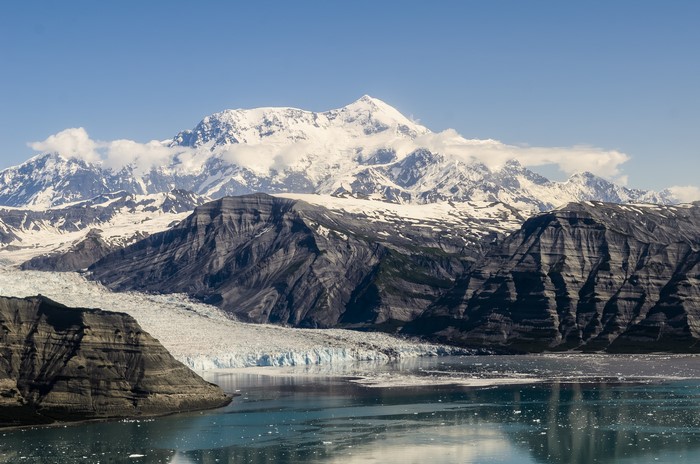 Snow-capped mountains and glacier meeting the ocean