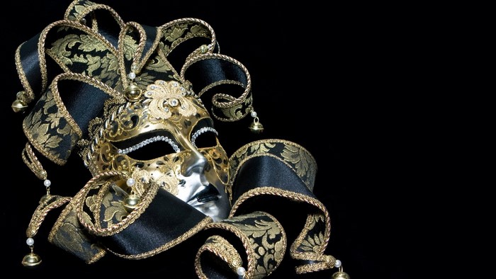 Gold and black masquerade mask with ribbons