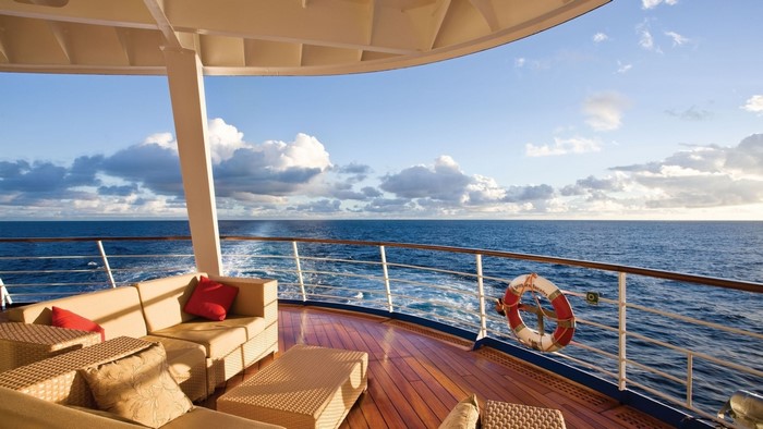 Cruise ship deck with ocean view and seating