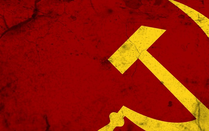 Hammer and sickle symbol on a red background