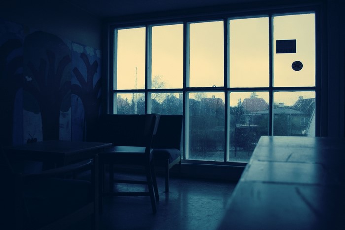 Room with a window on a rainy day