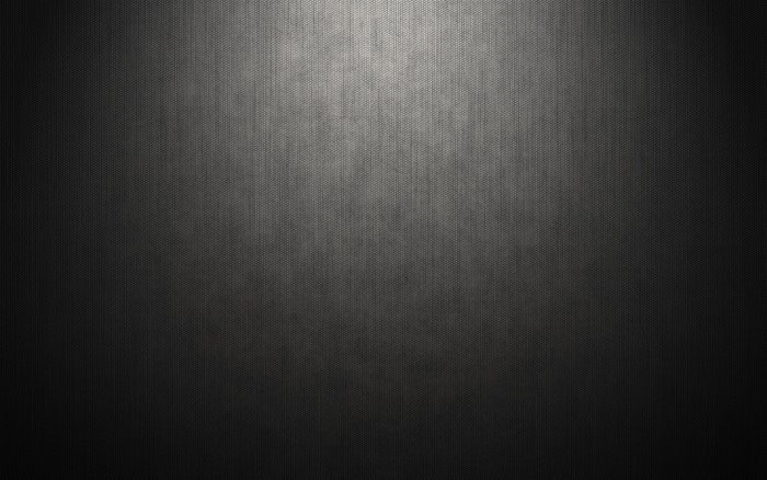 Dark textured surface with light gradient