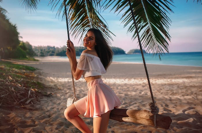Galina Dubenenko on a swing at the beach