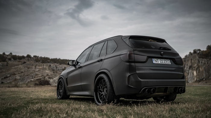 Matte black BMW X5 with custom wheels