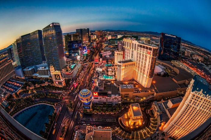 Las Vegas Strip at dusk with illuminated buildings