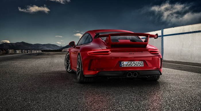 Red Porsche 911 GT3 on a race track
