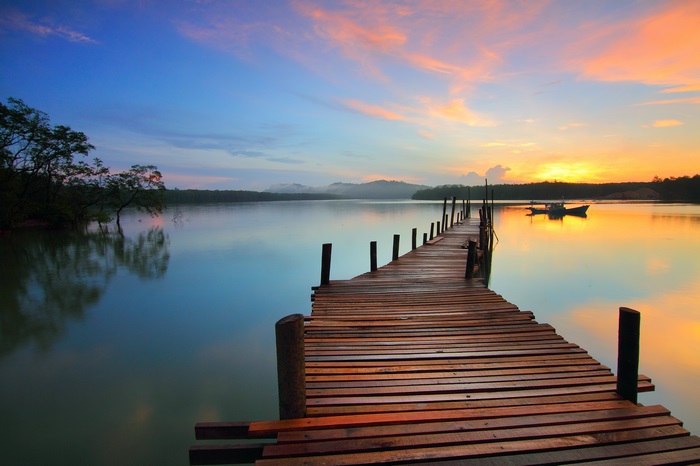 Wooden pier on a lake at sunrise
