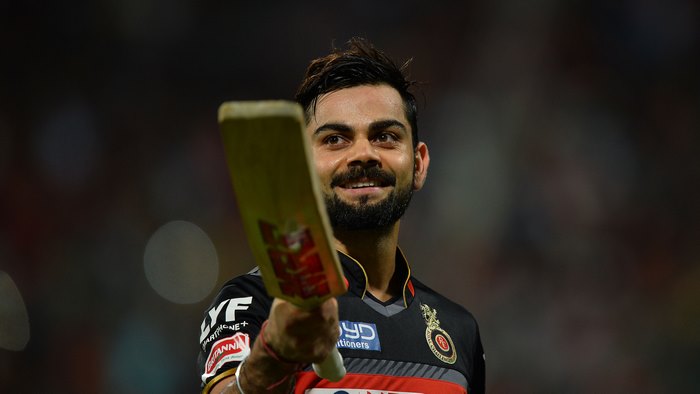 Virat Kohli holding a cricket bat