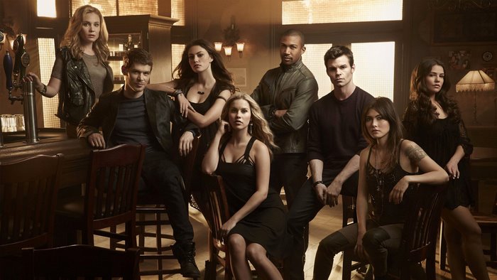 The Originals cast posing in a bar