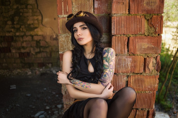 Woman in Steampunk Hat with Tattoos