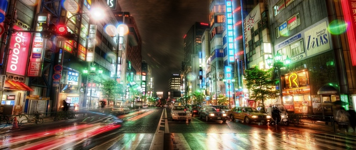 Night street in Tokyo, Japan with neon lights and traffic
