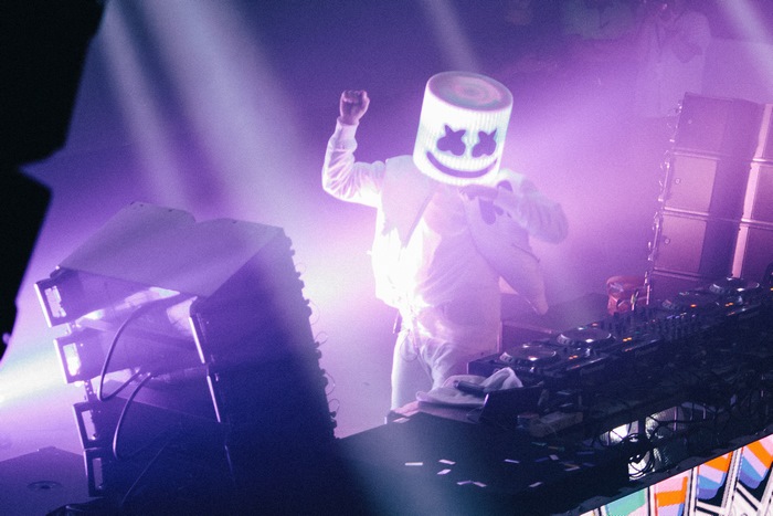Marshmello performing on stage with DJ equipment
