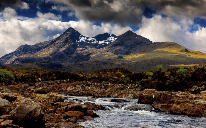 Mountain range with river and rocky foreground