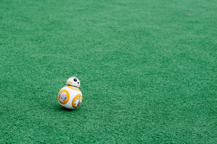 BB-8 droid on a green turf field