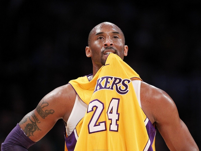 Kobe Bryant Holding Lakers Jersey Number 24