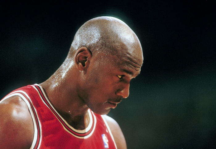 Michael Jordan in a red basketball jersey