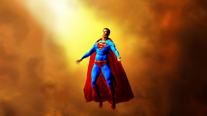 Superman flying in a cloudy sky
