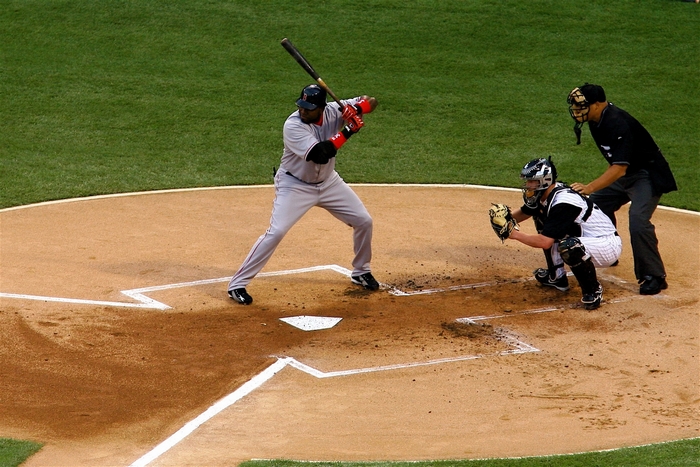 Baseball batter, catcher, and umpire on field