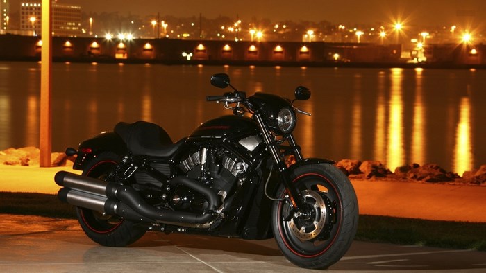 Black Harley Davidson Motorcycle by Water at Night