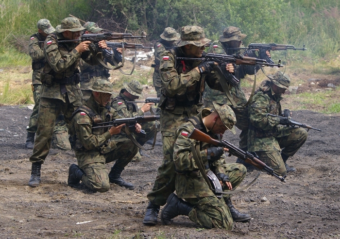 Soldiers in camouflage uniforms with rifles