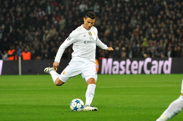 Cristiano Ronaldo kicking a soccer ball