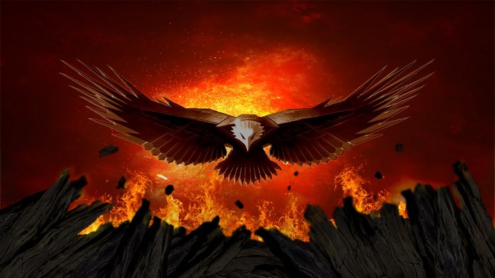 Eagle flying over a fiery landscape