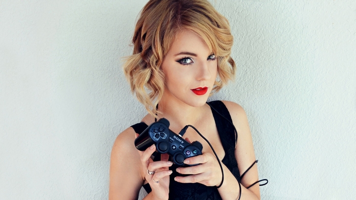 Woman holding a Sony PlayStation controller