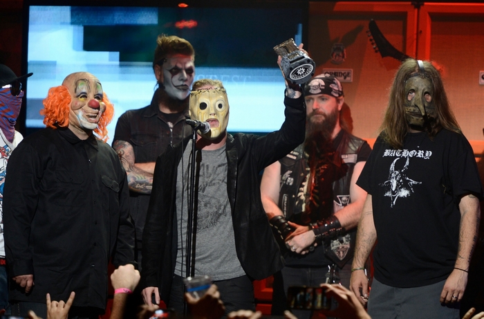 Slipknot members on stage holding an award