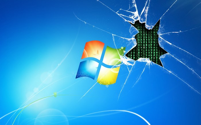 Windows 7 desktop with cracked screen and Matrix code