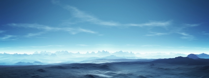 Vast blue mountain landscape with wispy clouds