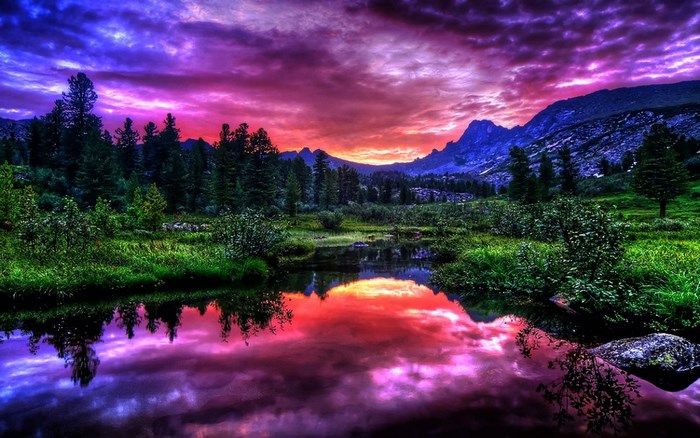 Colorful mountain landscape with lake reflection