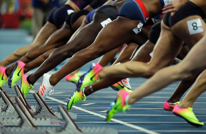 Track and field runners at the starting blocks