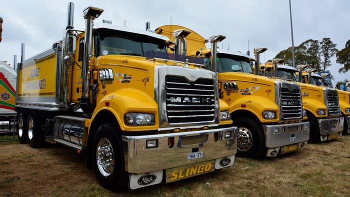 Yellow Mack trucks lined up