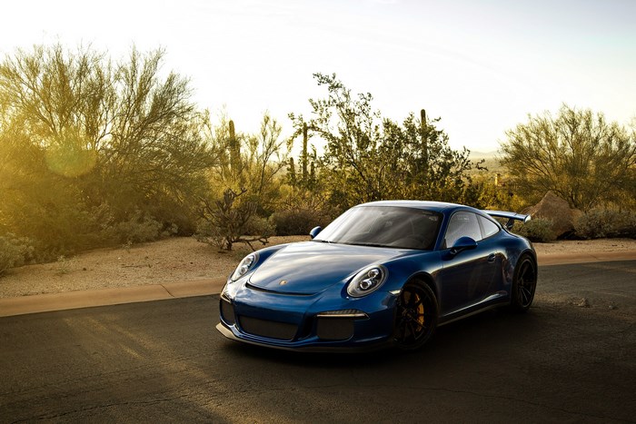 Blue Porsche 911 GT3 in desert landscape