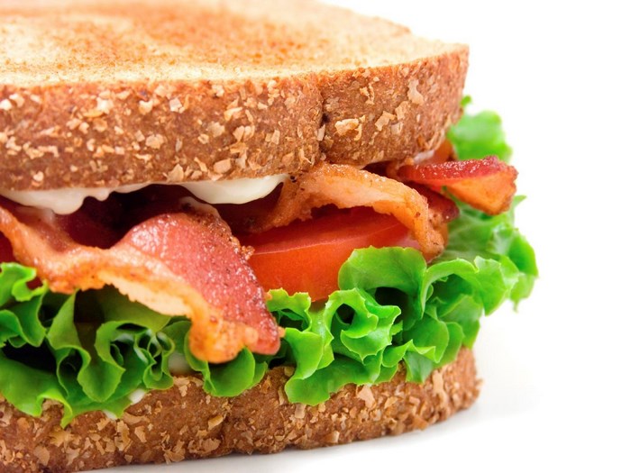 Close-up of a bacon, lettuce, and tomato sandwich
