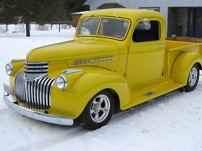 Yellow Chevrolet Pickup Truck in Snow