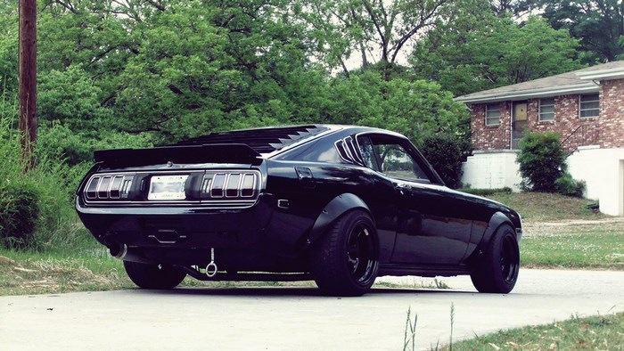 Black Toyota Celica parked on a street