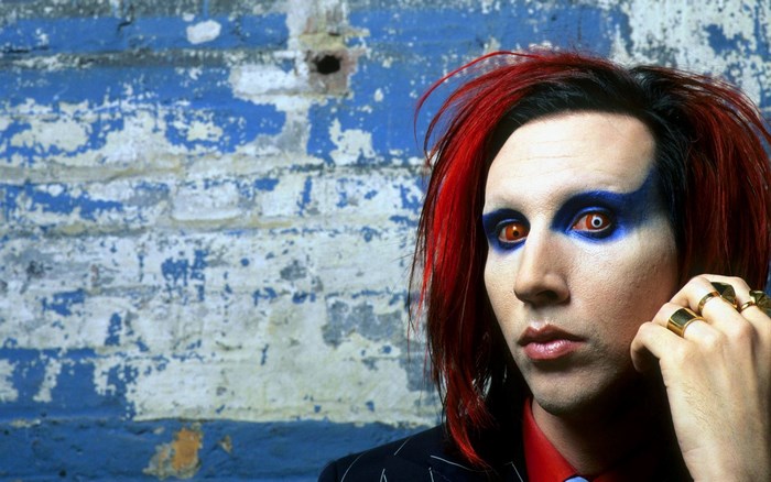 Marilyn Manson with red hair and makeup