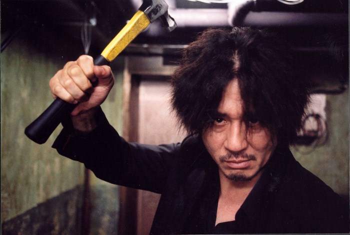 Man holding a hammer from Oldboy