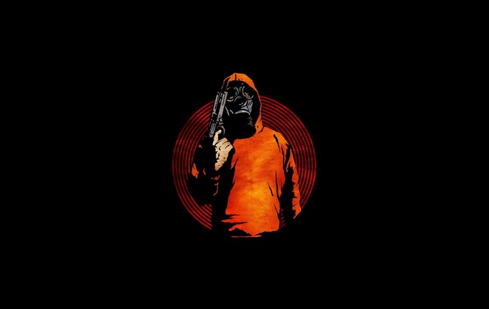 Man in gas mask and orange hoodie holding gun