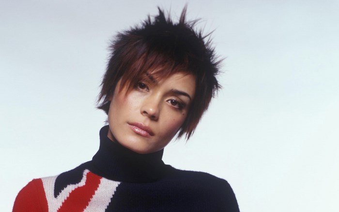Shannyn Sossamon with spiky hair and Union Jack sweater
