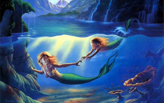 Two mermaids reaching for each other underwater