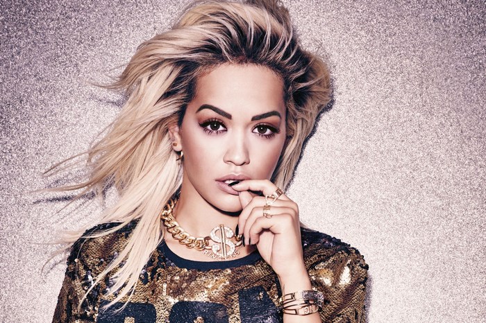 Rita Ora wearing a sequined top and jewelry
