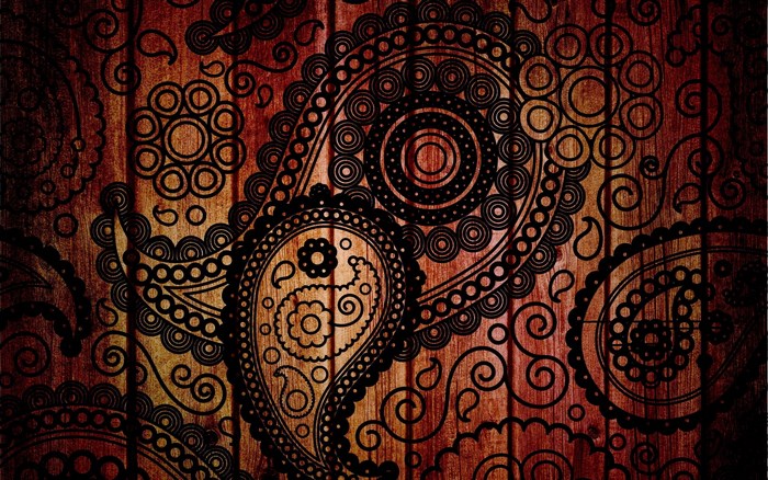 Paisley pattern on wood texture
