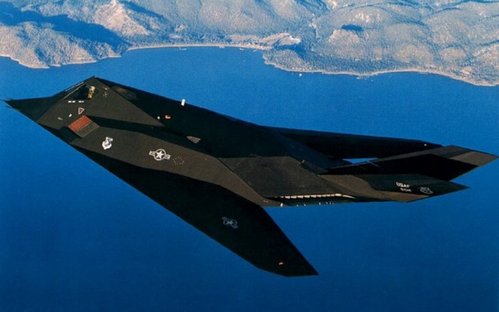 Lockheed F-117 Nighthawk flying over a lake